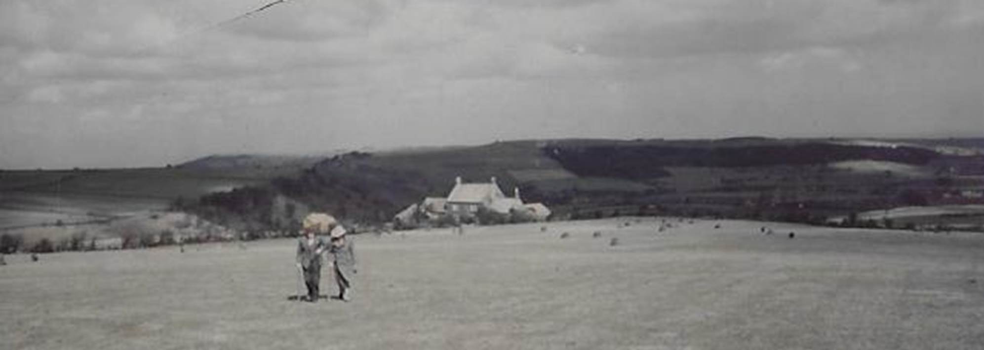 A group of people standing on top of a sandy beach
Description automatically generated